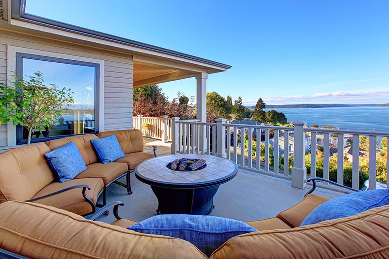 Cozy patio area with waterfront view seen during a home inspection 